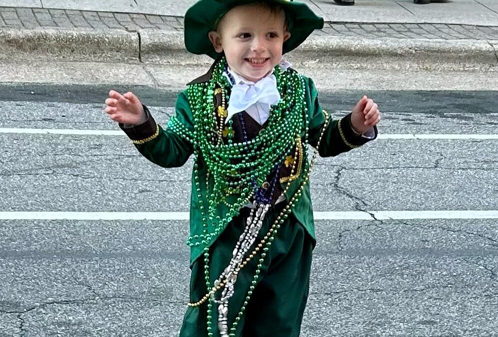 Photos of the Raleigh St. Patrick's Day Parade. Kids, adults and lots of balloons, Grand Marshal Sandra Holland. Downtown Raleigh, NC. 