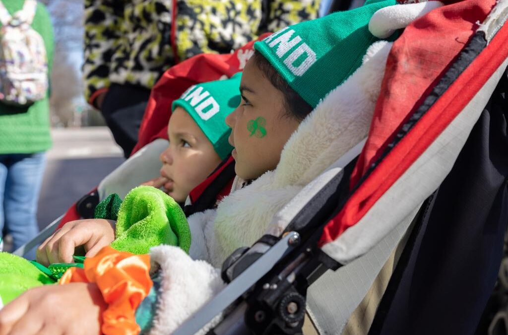 Photos of the Raleigh St. Patrick's Day Parade. Kids, adults and lots of balloons, Grand Marshal Sandra Holland. Downtown Raleigh, NC. 