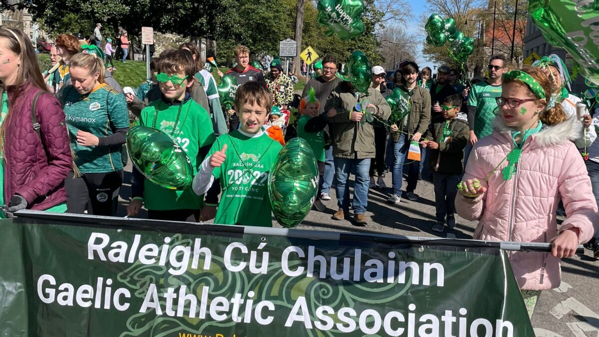 Photos of the Raleigh St. Patrick's Day Parade. Kids, adults and lots of balloons, Grand Marshal Sandra Holland. Downtown Raleigh, NC. 
