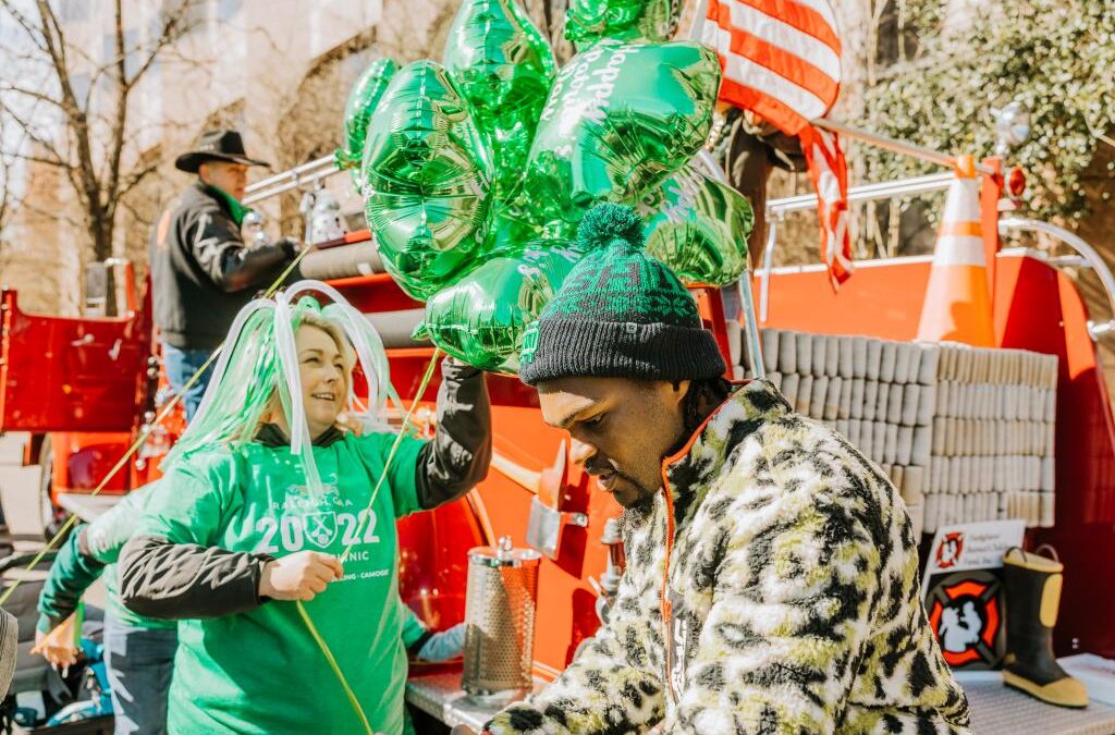 Photos of the Raleigh St. Patrick's Day Parade. Kids, adults and lots of balloons, Grand Marshal Sandra Holland. Downtown Raleigh, NC. 